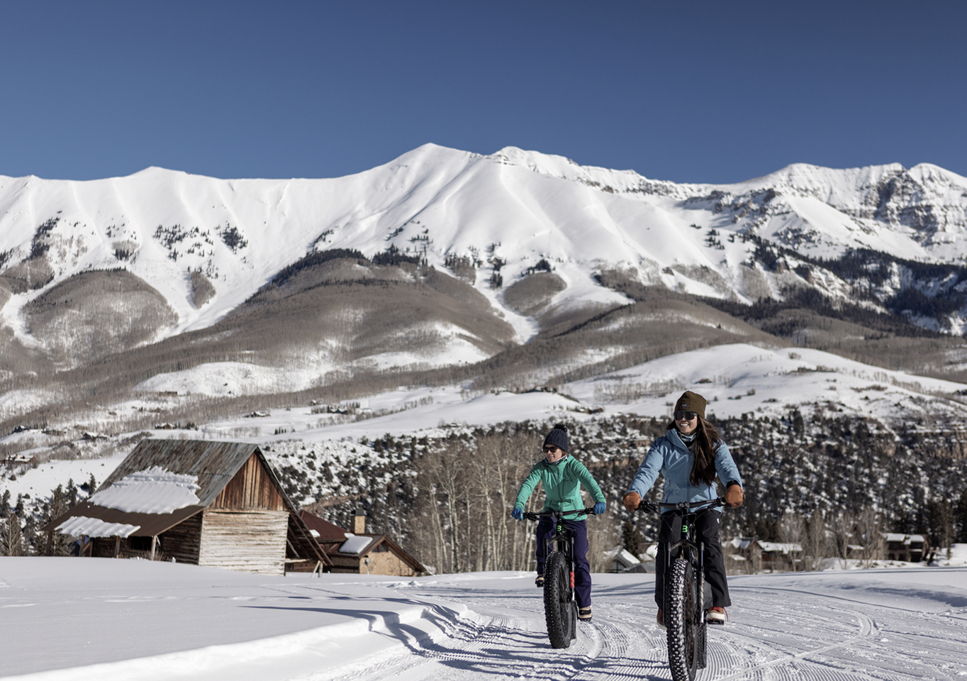 Two people biking in the mountains of Telluride Colorad