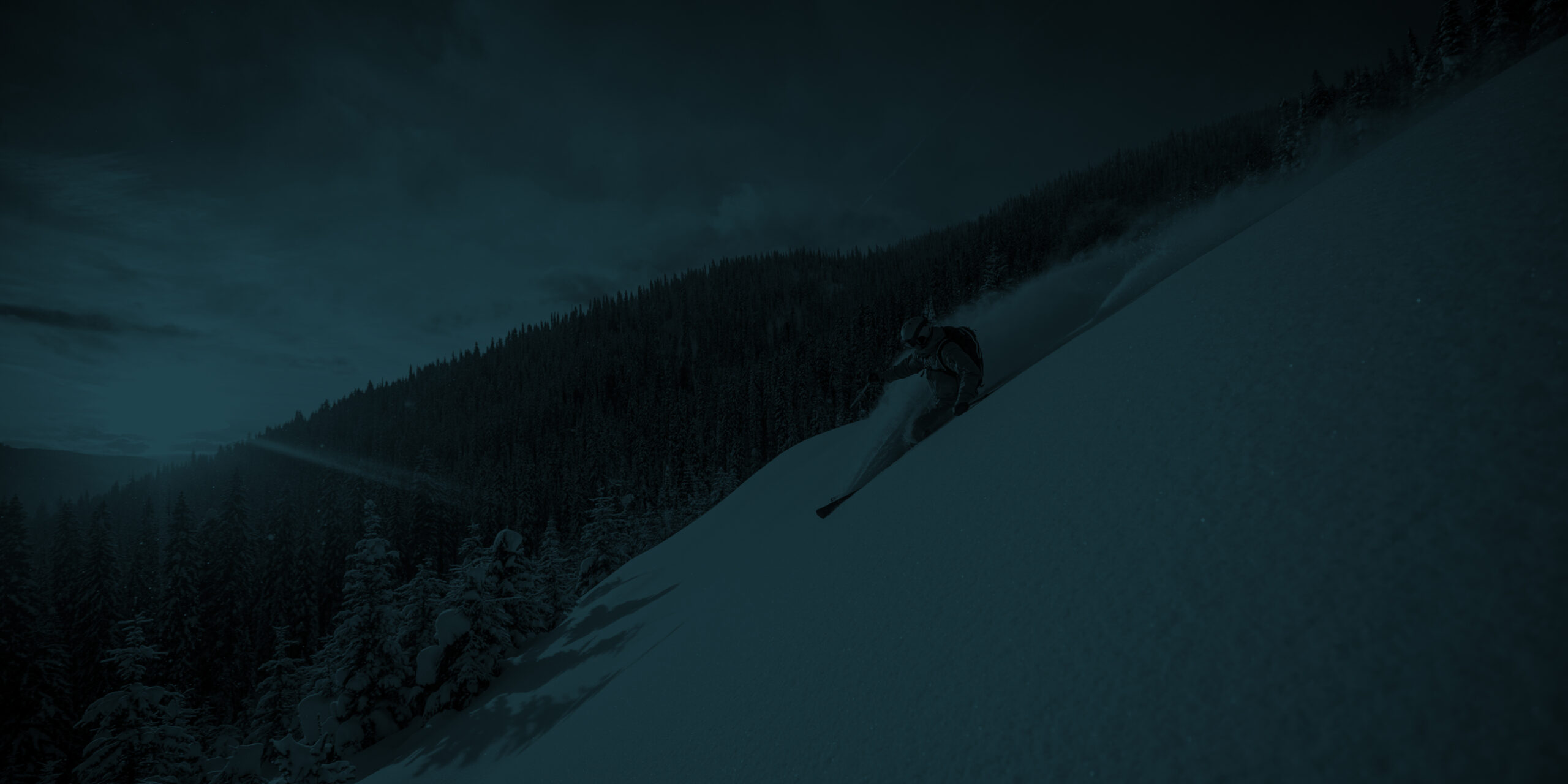 Skier skiing down black diamond in Telluride Colorad