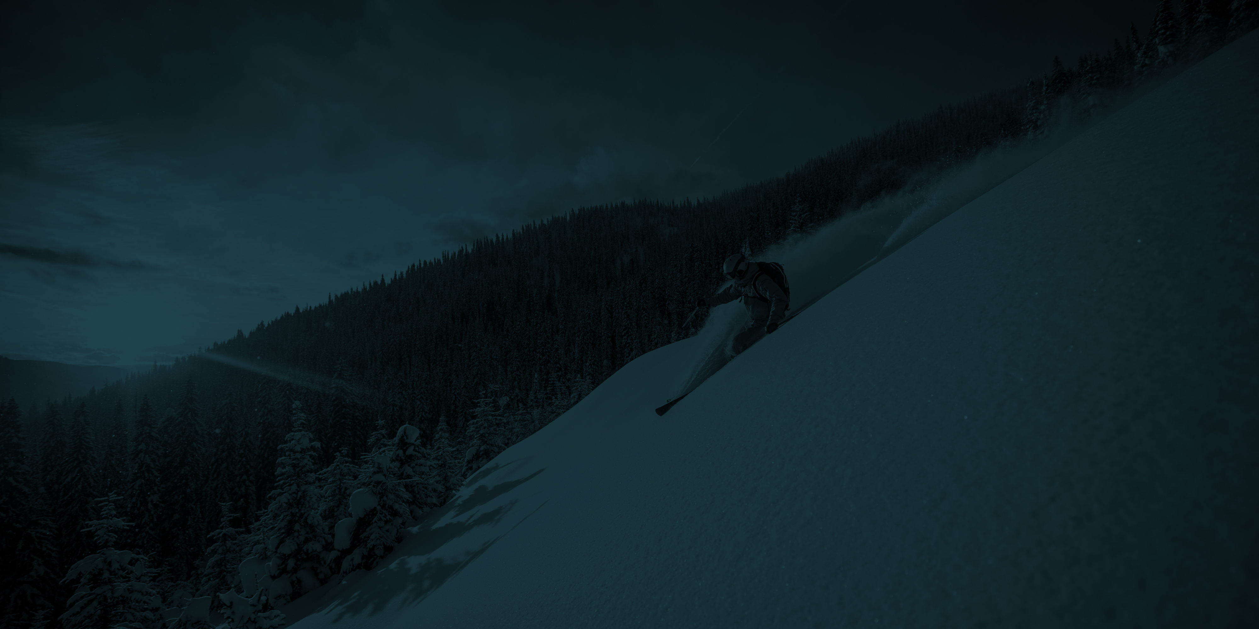Skier skiing down black diamond in Telluride Colorad